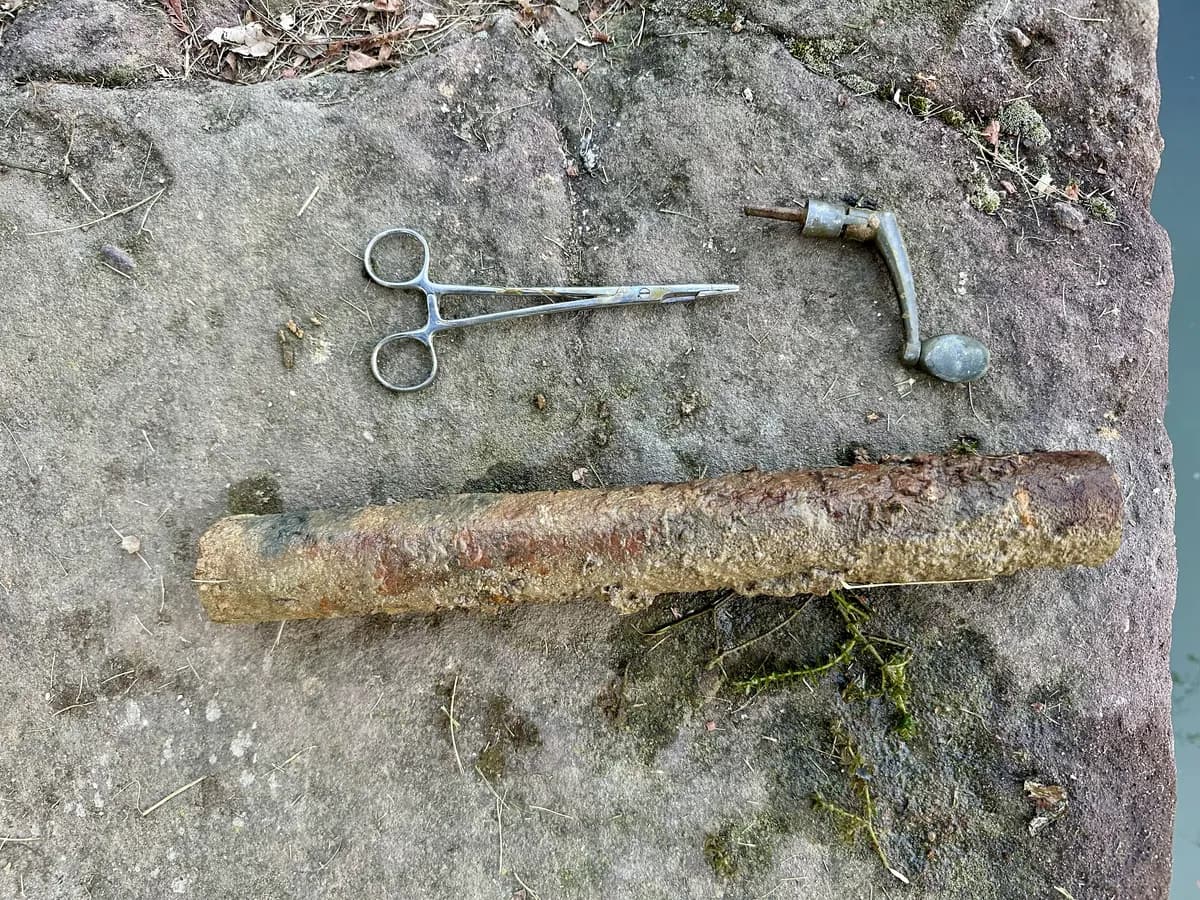 Magnet fishing find: Forceps, a window crank, and rusted iron pulled from the Union Canal