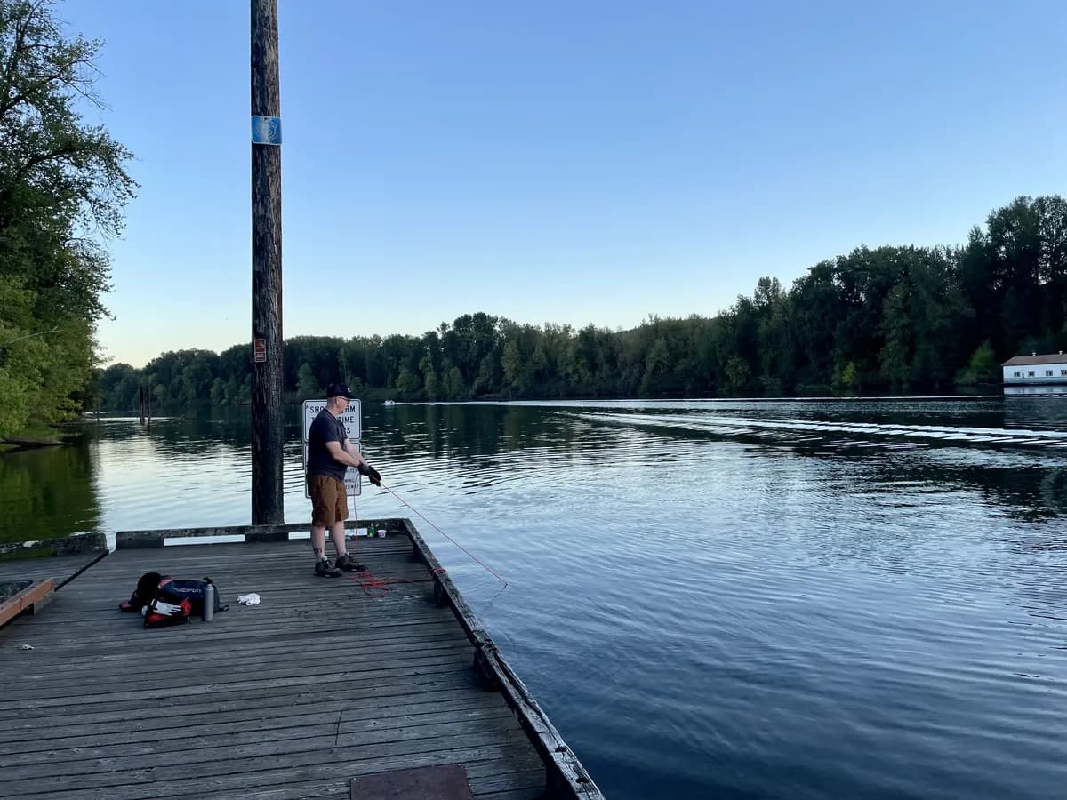 Will Flaiz dragging a magnet along the bottom of the Willamette River from a public dock